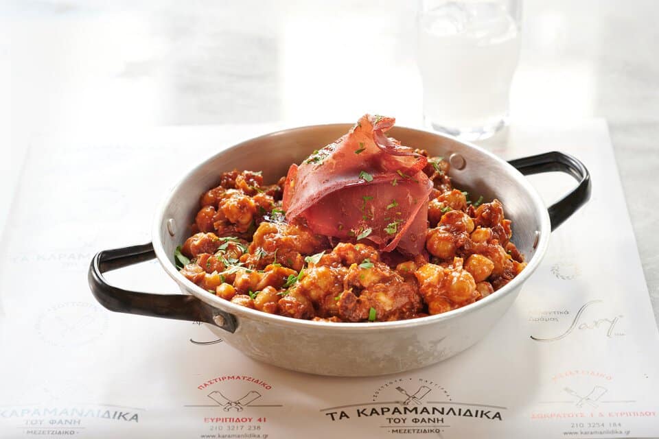 Chickpeas with pastirma, in spicy Cappadocian sauce. A main course at Karamanlidika Food-Artistry restaurant, on 119 Ermou str., in Athens.